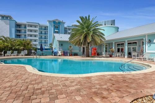 a swimming pool in front of a building at Cape Crossing 103 in Merritt Island