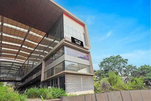 a building with a sign on the side of it at Super Hotel O Ugat Canal Surat Formerly Royal Orbit in Rānder