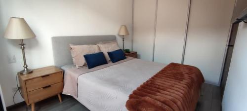 Ένα ή περισσότερα κρεβάτια σε δωμάτιο στο Apartamento moderno a 10 minutos del Aeropuerto