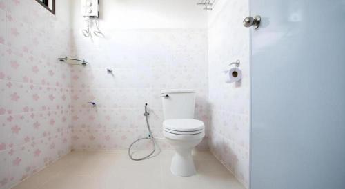 a bathroom with a toilet and a shower in it at Thatphanom View Hotel Nakhon in Nakhon Phanom