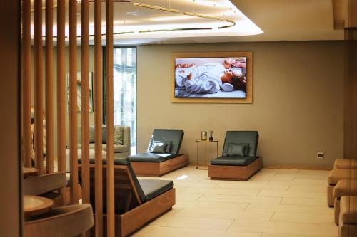 The Houghton Hotel, Spa, Wellness & Golfにあるテレビまたはエンターテインメントセンター