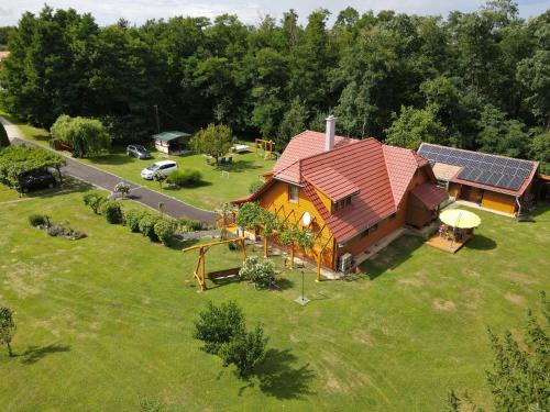 an overhead view of a house with a solar roof at Ezerjó Ökofogadó in Őriszentpéter