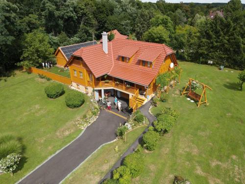 an overhead view of a large house with a playground at Ezerjó Ökofogadó in Őriszentpéter