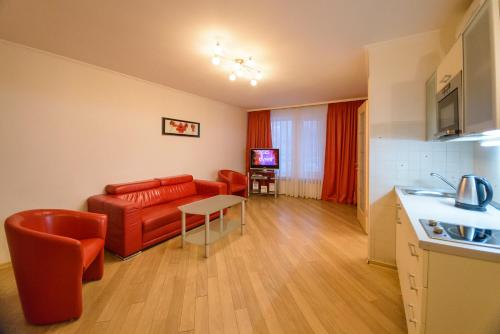 a living room with a couch and a table at Partner Guest House in Kyiv
