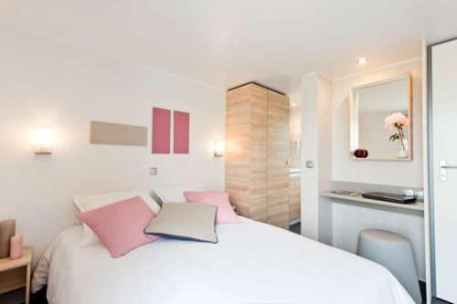 Ένα ή περισσότερα κρεβάτια σε δωμάτιο στο Résidence de vacances Villa Cottage