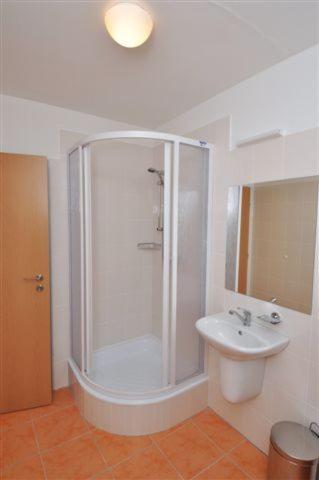 a bathroom with a shower and a sink at Sport Hotel Ticha Orlice in Ústí nad Orlicí