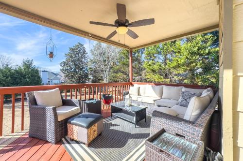 a patio with a couch and chairs on a deck at 530 Waterford Drive Cartersville in Cartersville