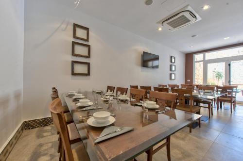 a large dining room with a large table and chairs at Palazzo Violetta in Sliema