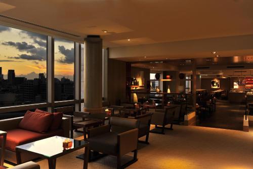 a restaurant with a view of a city at Grand Hyatt Tokyo in Tokyo
