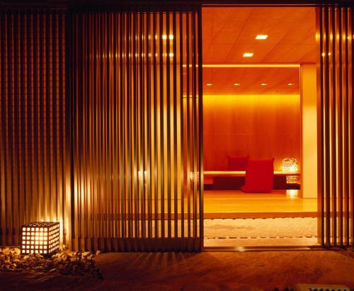 a lobby of a building with a room with a couch at Grand Hyatt Tokyo in Tokyo