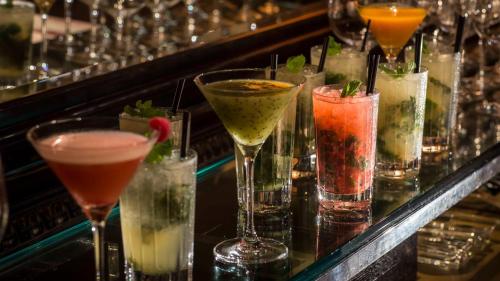 a row of different cocktails on a bar at Grand Hyatt Tokyo in Tokyo