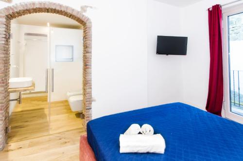 Postel nebo postele na pokoji v ubytování Hotel Diffuso Antichi Ricordi