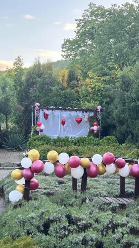 a group of mushrooms in a garden with a table at Hotel Sobotel & Spa klimatyzowany in Sobótka