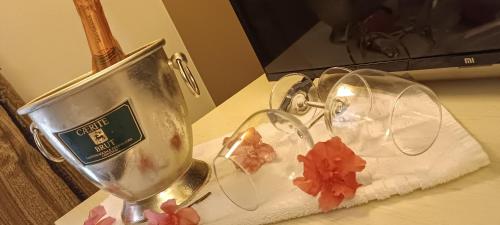 a table with two wine glasses on a table at DCBoutiqueHotel in Rome
