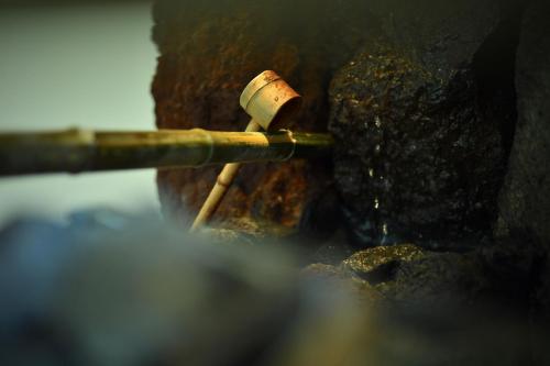 a cigarette sitting on top of a rock at Ochiairo in Izu