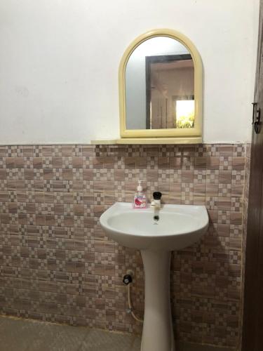 Een badkamer bij Saman Restaurant - Family House