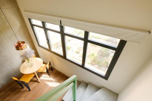 a room with a table and a large window at Magatzem 128 in Barcelona