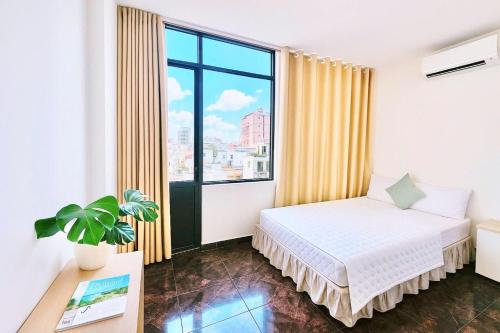 Ένα ή περισσότερα κρεβάτια σε δωμάτιο στο New Sunny Hotel