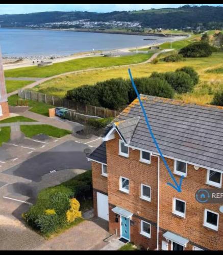 an aerial view of a brick building with a house at South Wales Coastal Retreat in Llanelli
