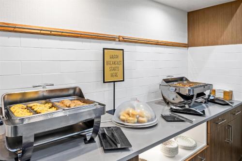 a kitchen with a counter with some food on it at Hampton Inn & Suites Farmington in Farmington