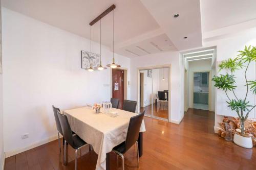 a dining room with a table and chairs at Book and Bed-People's Square in Shanghai