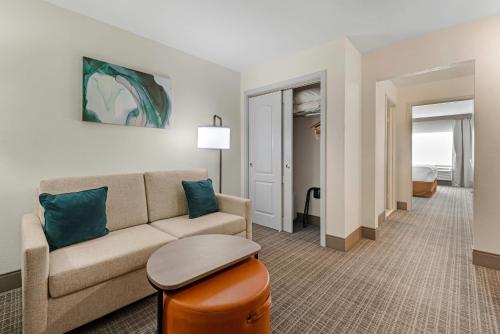 a living room with a couch and a table at Comfort Inn & Suites Carbondale on the Roaring Fork in Carbondale