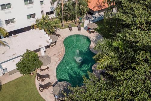 an overhead view of a swimming pool in a building at Comfort Inn Puerto Vallarta Golfside & Marina in Puerto Vallarta