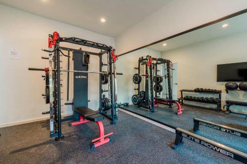 a gym with two weight machines in a room at Comfort Inn Puerto Vallarta Golfside & Marina in Puerto Vallarta