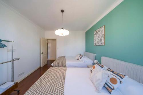 a room with two beds in a room at Book and Bed-People's Square in Shanghai