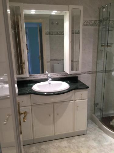 a bathroom with a sink and a shower at Ocean Point in Mijas Costa