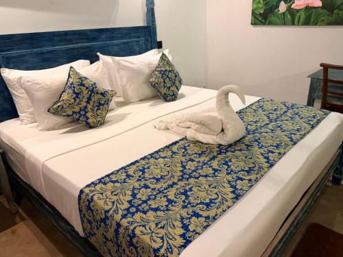 Cama o camas de una habitación en Bedazzle Waves Wadduwa