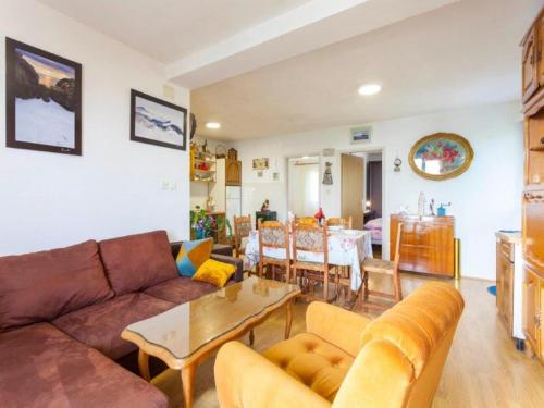 a living room with a couch and a table at Villa in Tučepi with Pool near Seabeach in Tučepi