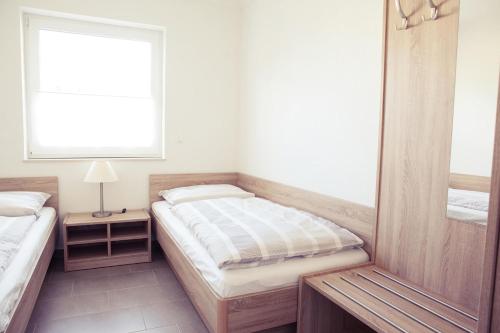 Postel nebo postele na pokoji v ubytování Ferienhaus Friedrichsmilde