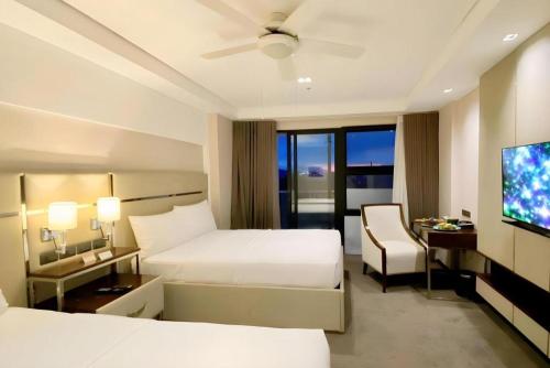 Ένα ή περισσότερα κρεβάτια σε δωμάτιο στο The Plaza Lodge Baguio