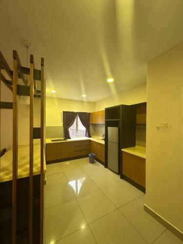 a room with a kitchen with bunk beds and a window at gold coast morib by tim in Banting