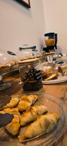 a table with a bunch of pastries on it at DCBoutiqueHotel in Rome