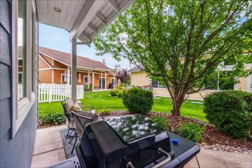 a patio with a table and chairs on a house at Dover Bay in Dover