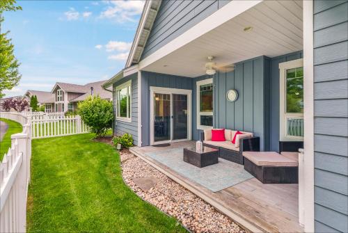 a house with a porch with a bench and a yard at Dover Bay in Dover
