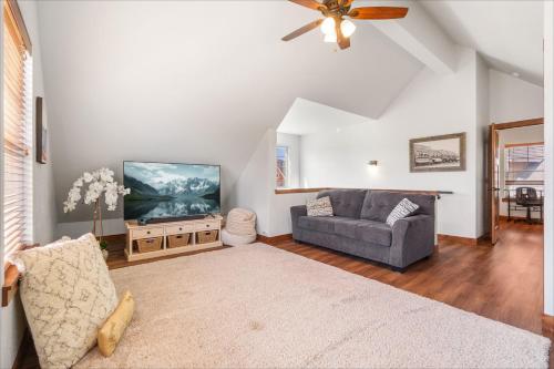 a living room with a couch and a flat screen tv at Dover Bay in Dover