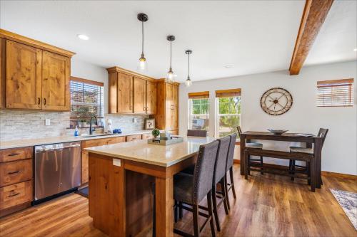 a kitchen with wooden cabinets and a table with chairs at Dover Bay in Dover
