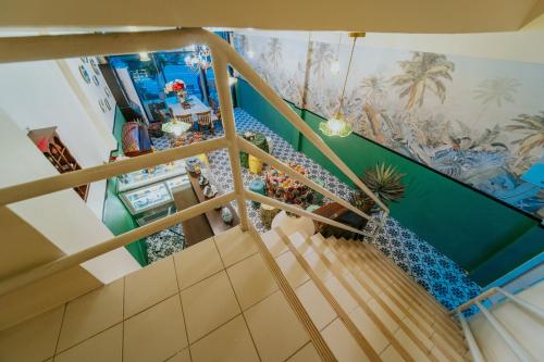 an overhead view of a staircase in a house at Nyonya Maison Boutique Hotel Phuket Old Town in Phuket Town