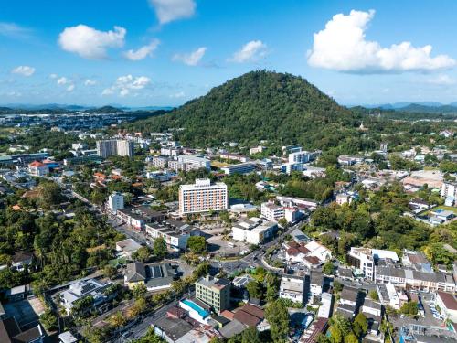 an aerial view of a city with a mountain at Nyonya Maison Boutique Hotel Phuket Old Town in Phuket Town