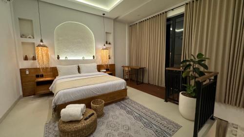 a bedroom with a large bed and a large window at Casa Ola Canggu in Pererenan