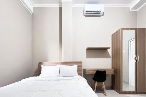 Katil atau katil-katil dalam bilik di Pesona Merapi Syariah Guesthouse Kaliurang RedPartner
