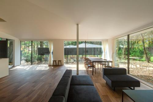 a living room with a couch and a table at Mori no Hanare in Karuizawa