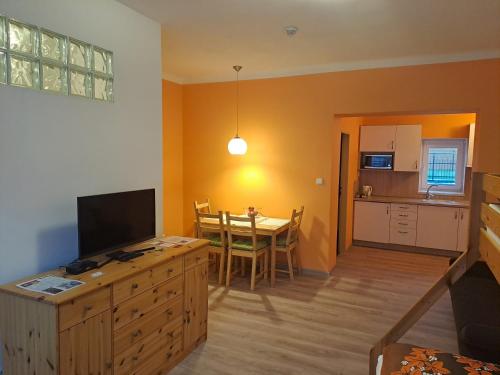 a living room with a kitchen and a dining room at Villa Joanna in Františkovy Lázně