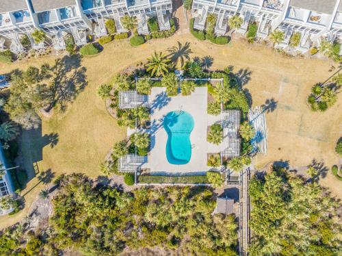 an aerial view of a swimming pool in a park at Beach Club Villa 27 - Oceanview Walkout by Beach and Pool in Isle of Palms