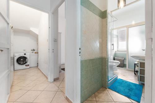 a bathroom with a shower and a toilet and a sink at Sardegna - Calasetta Paese in Calasetta