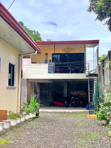 a house with a garage with a car parked in it at Valencia Studio apartment in Valencia