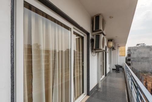 a balcony with sliding glass doors on a building at Hotel Florence sector 46 in Gurgaon